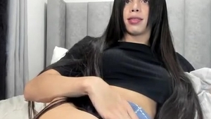 lengthy darksome Hair Transgirl Tugs Her large rod On cam